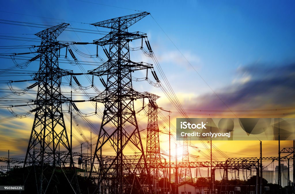 High pressure wire tower at sunset at dusk